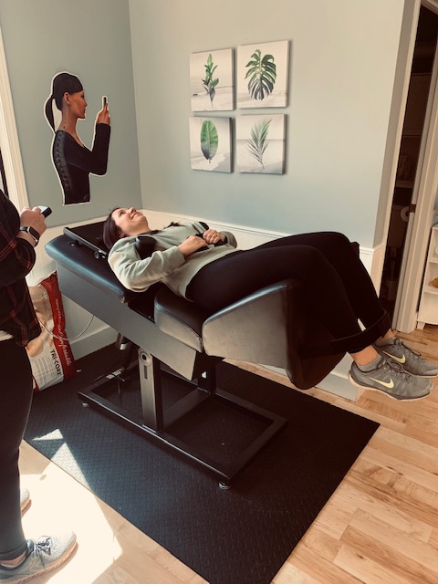 Patient receiving Back On Trac spinal decompression therapy at HealthMax Chiropractic of Hudson