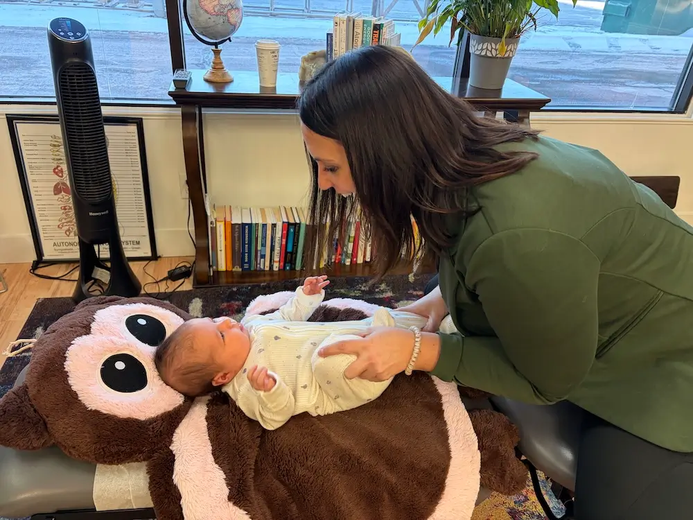 Child receiving gentle pediatric chiropractic care at HealthMax Chiropractic of Hudson