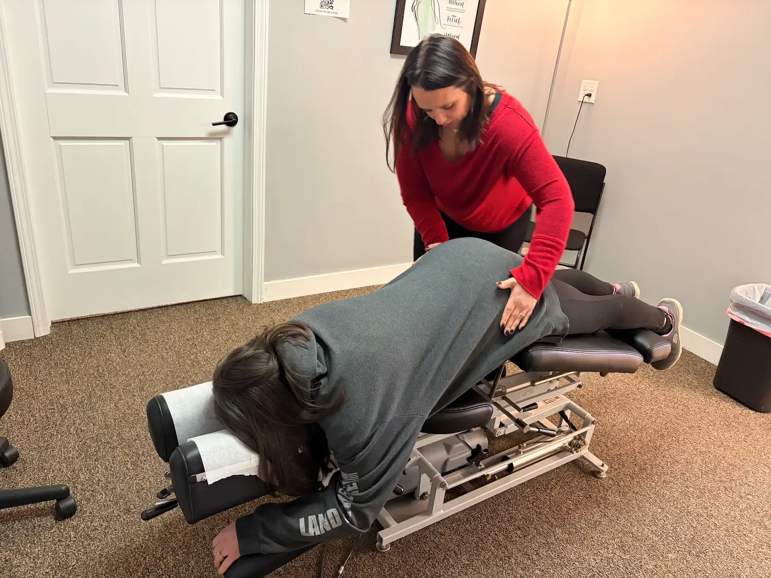 Patient receiving chiropractic care for low back pain at HealthMax Chiropractic of Hudson